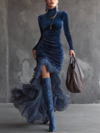 Dark blue velvet maxi dress with long sleeves, pleated ruched bodice and ruffled hem