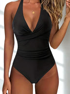 Black one-piece shaping swimsuit with deep V-neck and ruched midsection
