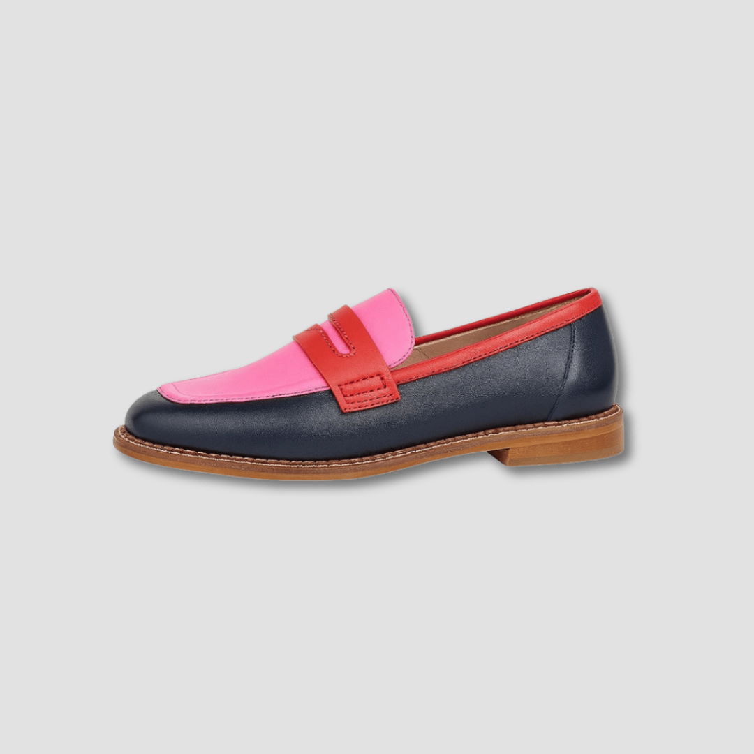 Pink and navy loafers with red strap and buckle detail, tan rubber sole
