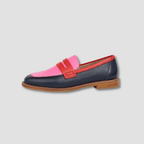 Pink and navy loafers with red strap and buckle detail, tan rubber sole
