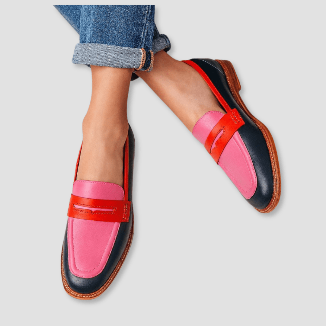 Pink and black statement loafer with red strap detail and contrast stitching