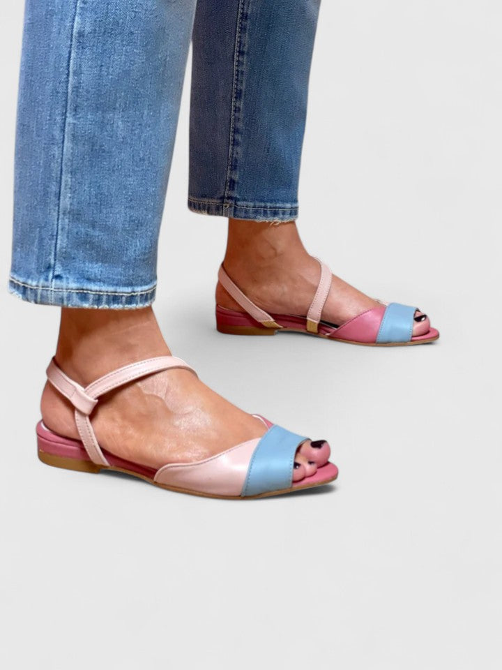 Pink and light blue open-toe sandals with ankle strap and decorative toe face
