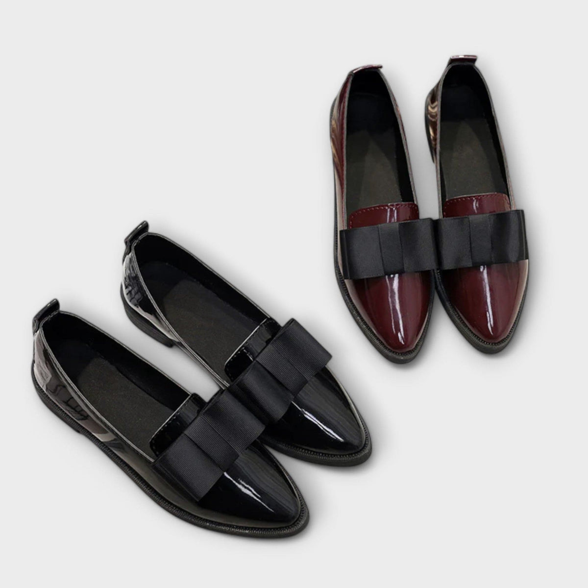 Lauren™ loafer pair: black and burgundy patent styles with black strap buckles