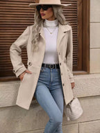 Light beige belted coat with epaulets, button front and long sleeves