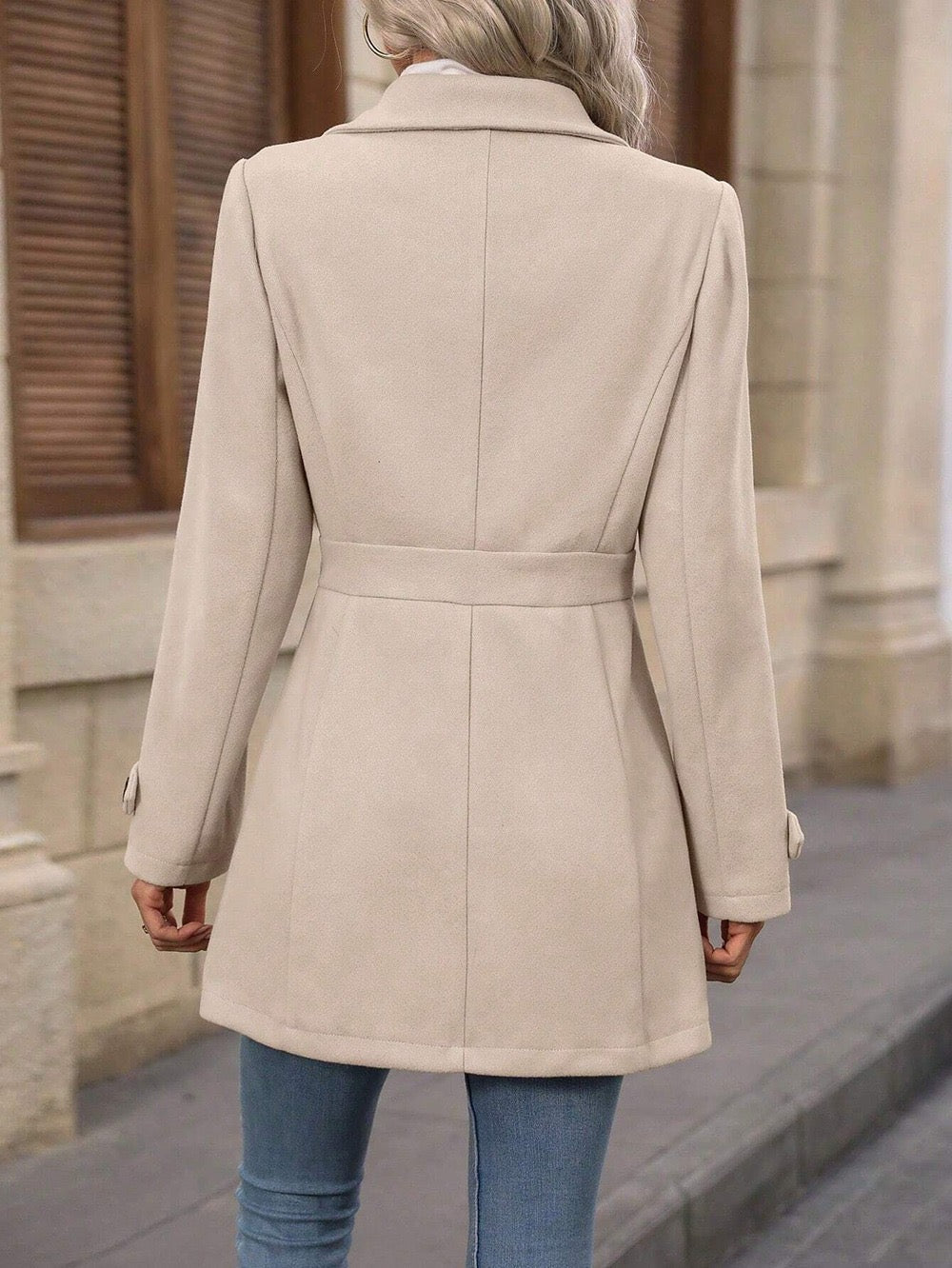 Beige belted coat back view with waist tie and long sleeves