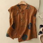 Brown short-sleeve linen top with multicolor abstract floral pattern and button placket