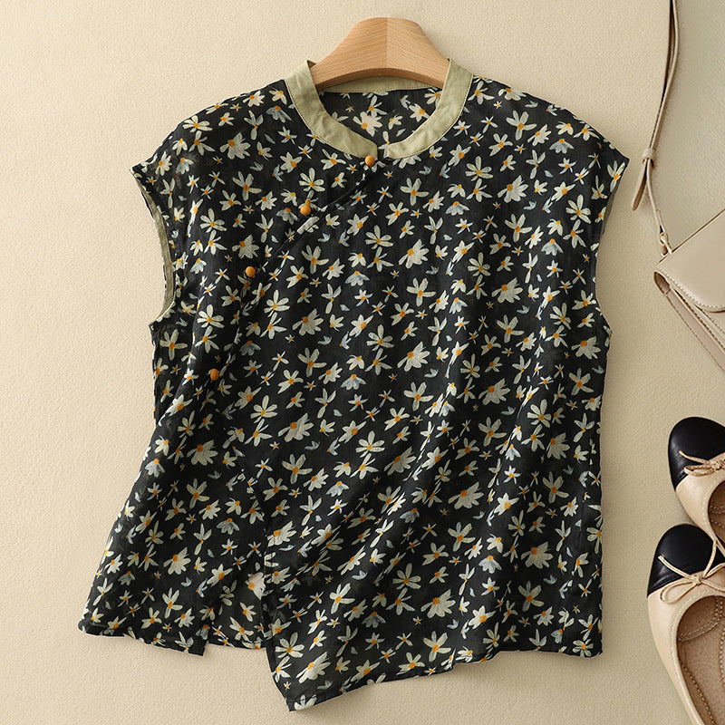 Black short-sleeve linen top with small daisy floral print and short button placket