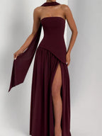 Strapless maxi dress with back halter tie, gathered tiered skirt, and side slit