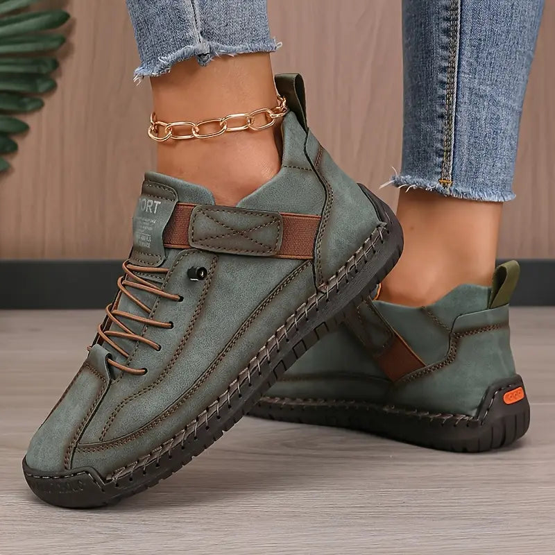 Green comfort support sneaker with lace-up, ankle chain, and padded heel strap