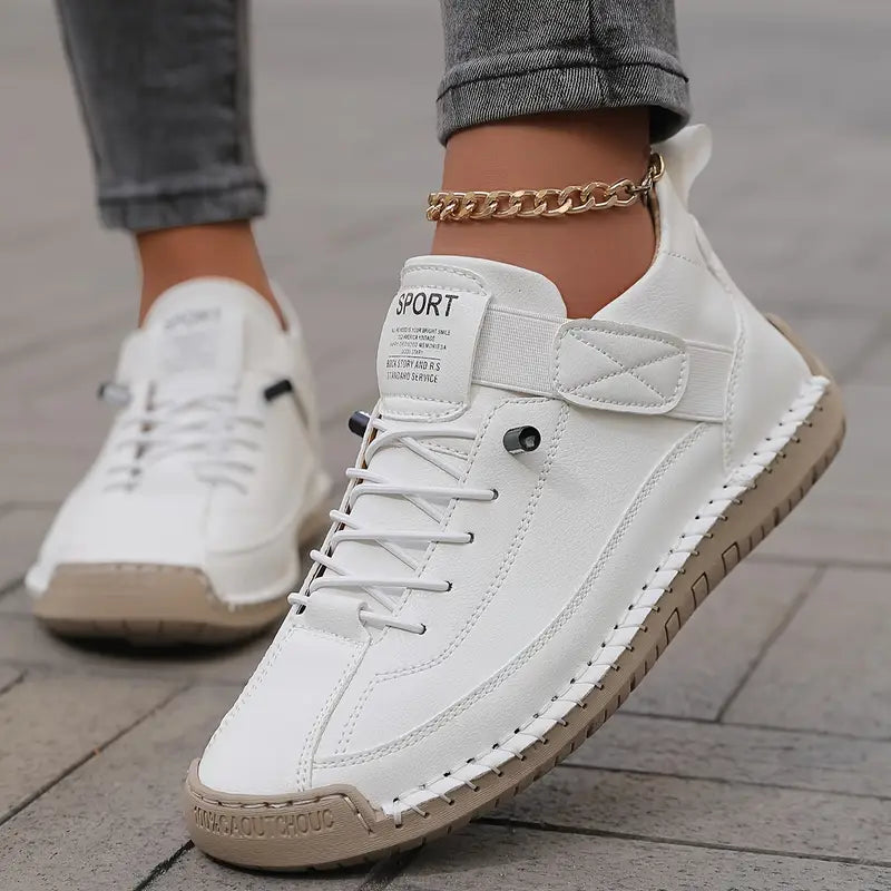 White comfort support sneaker with lace-up, ankle chain, and side stitching detail