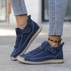 Dark blue comfort support sneaker with lace-up, ankle chain, and grippy rubber sole