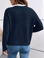 Kaitlyssa navy sweater, back view, with ribbed cuffs and V-neck lace trim