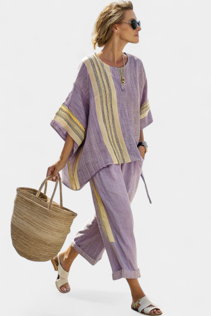 Purple two-piece set with vertical striped tunic top and matching wide pants