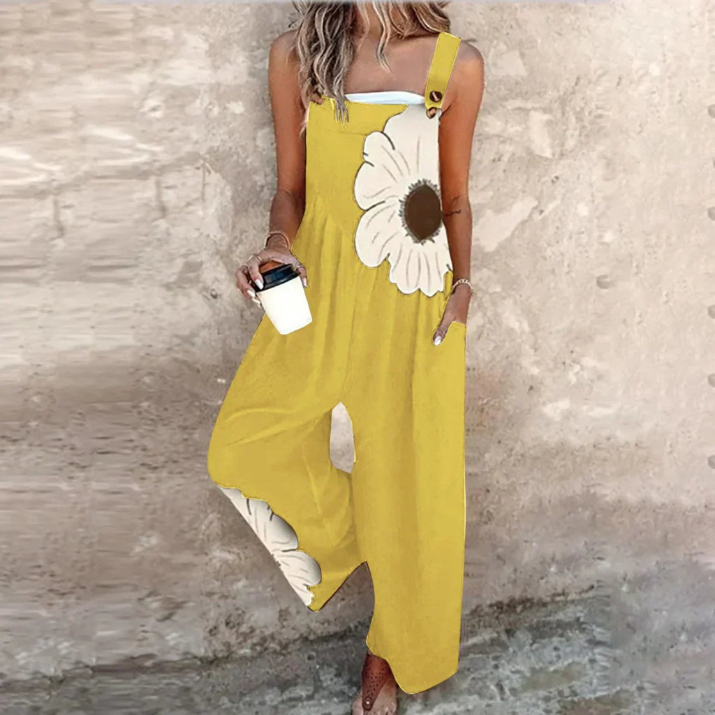 Yellow sleeveless jumpsuit with big white daisy print and wide-leg silhouette