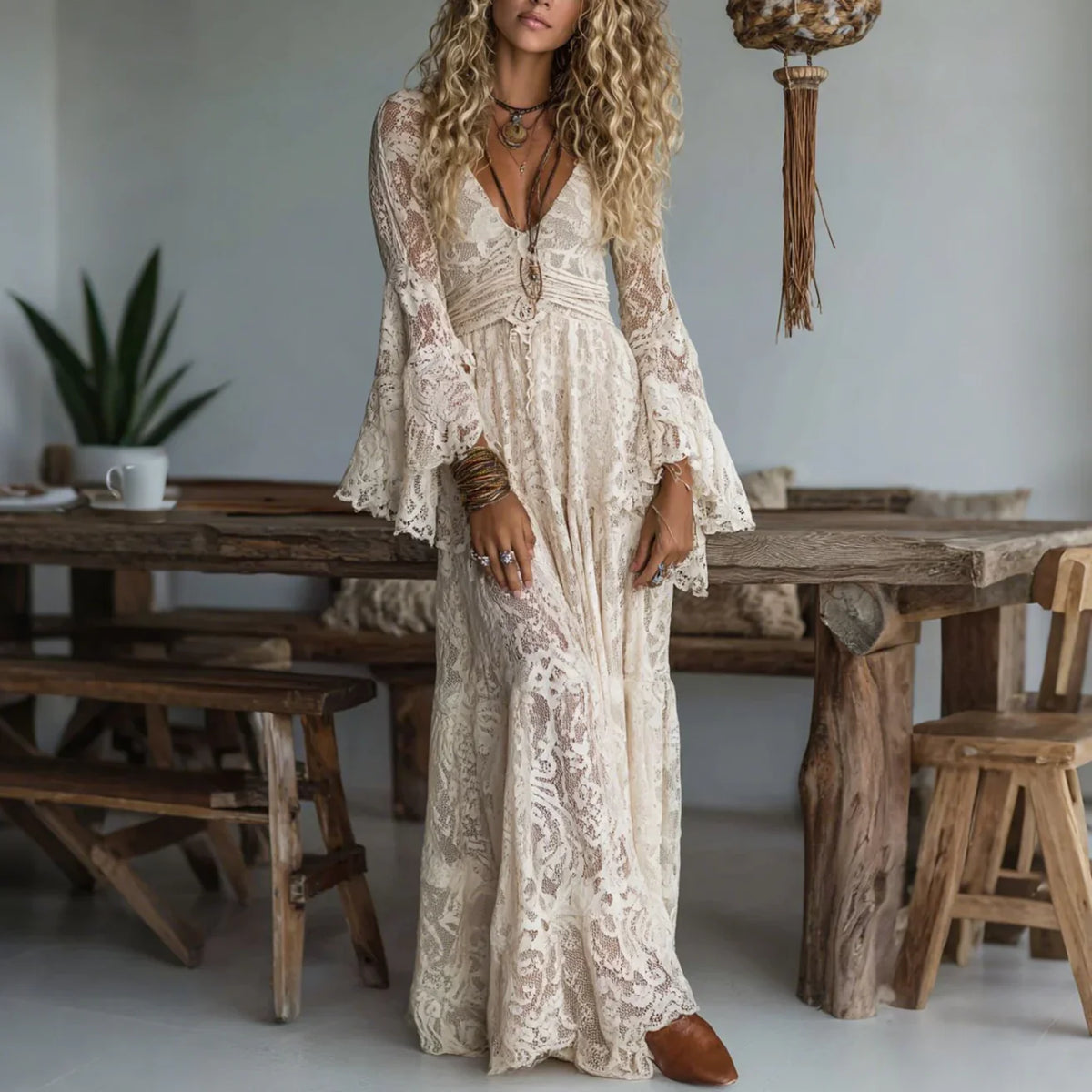 Ivory lace maxi dress with V-neck, long sleeves, and tiered skirt