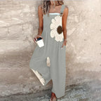 Gray sleeveless jumpsuit with white daisy print and wide-leg drape