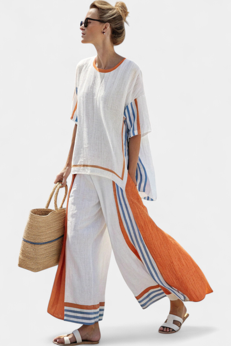 White two-piece set with orange and blue striped trim, loose tunic top and pants