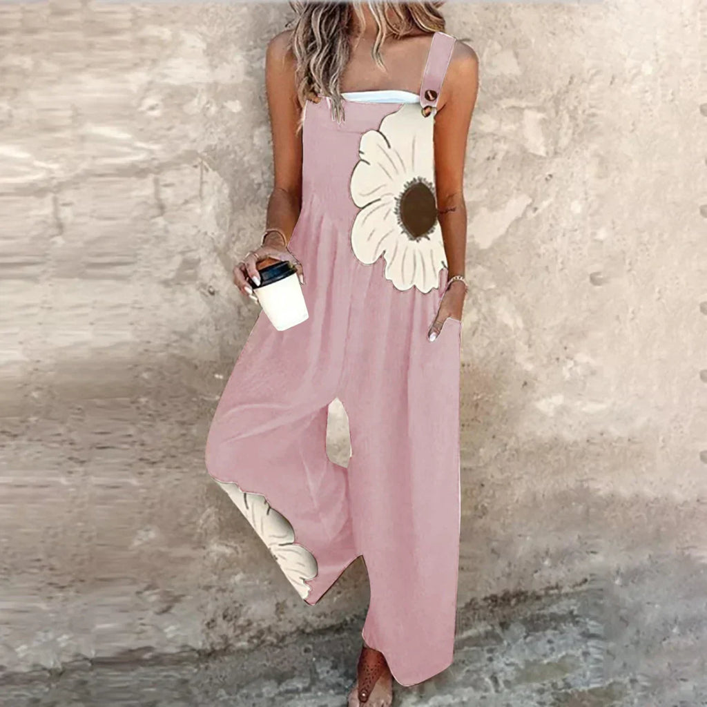 Pink sleeveless printed jumpsuit with oversized daisy motif, wide-leg pants