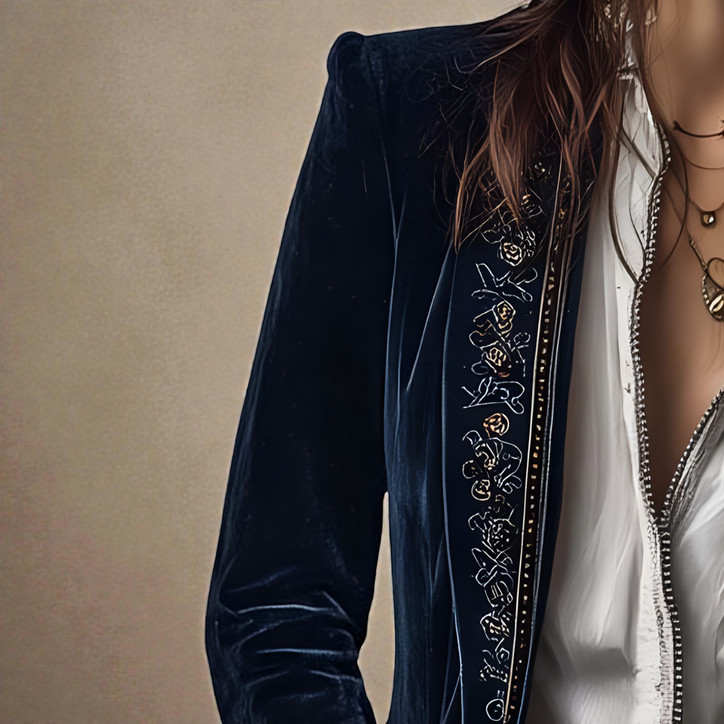 Midnight navy velvet blazer sleeve detail with ornate embroidered border