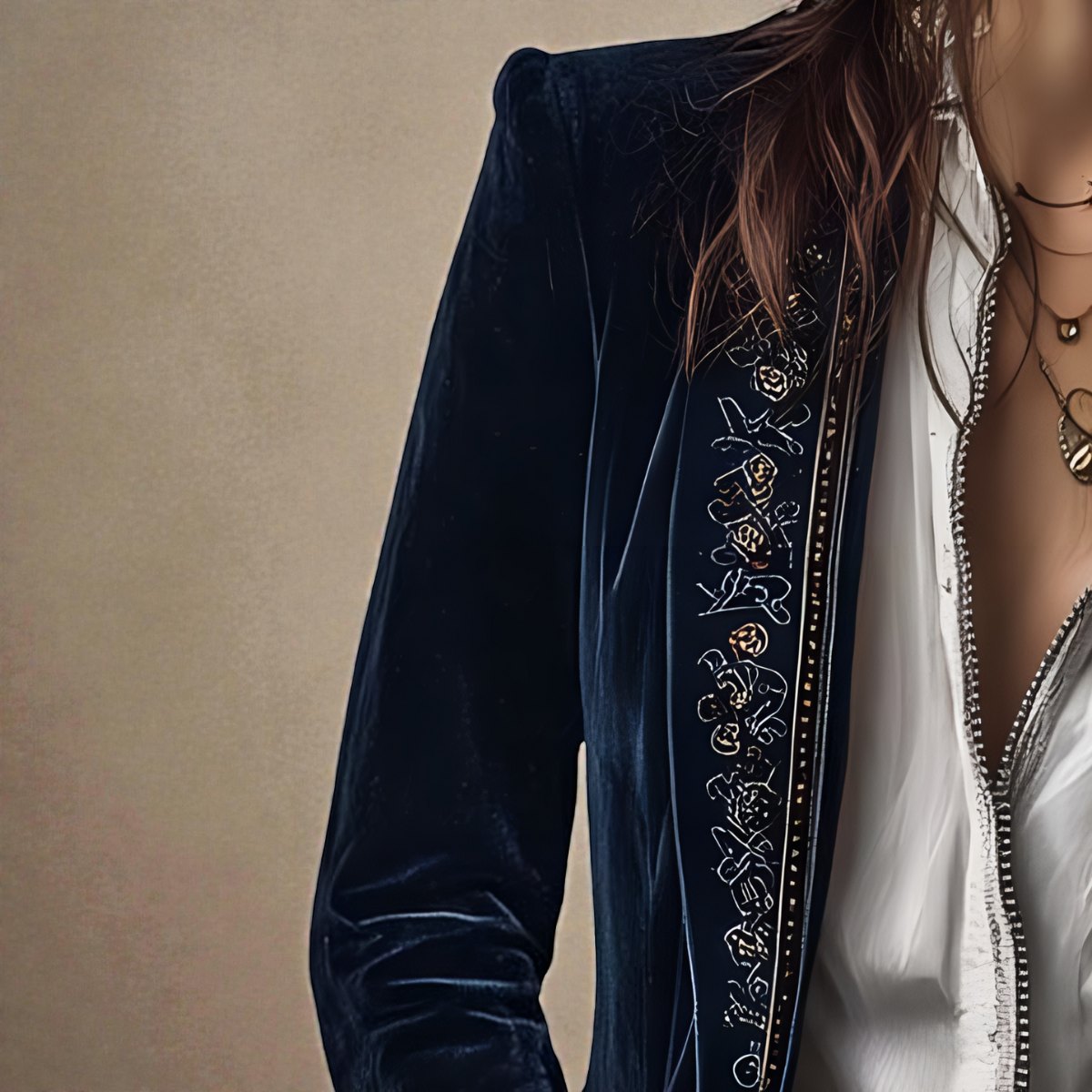 Midnight navy velvet blazer sleeve detail with ornate embroidered border