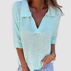 Light blue V-neck textured knit top with three-quarter sleeves