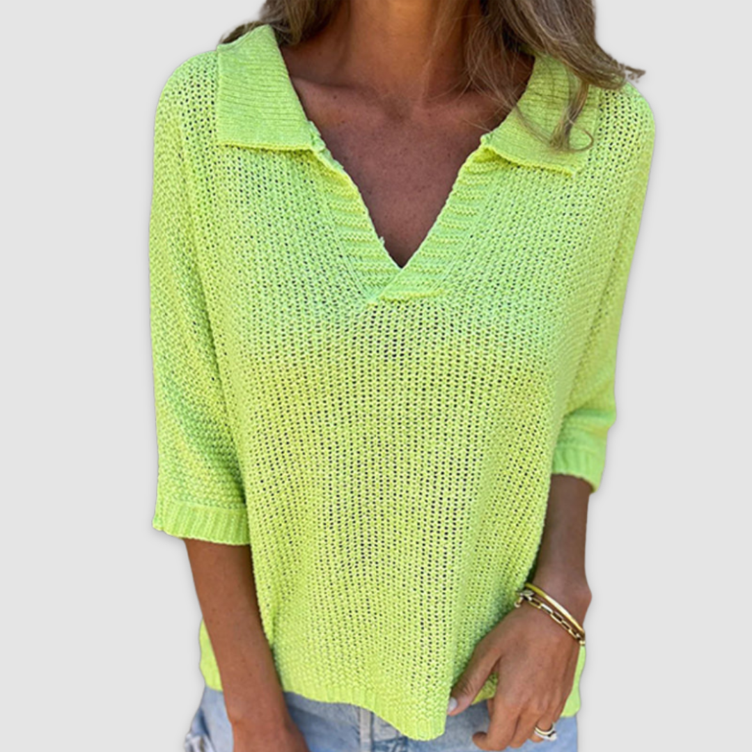 Green V-neck knit top with three-quarter sleeves and textured open-knit fabric