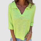 Green V-neck knit top with three-quarter sleeves and textured open-knit fabric