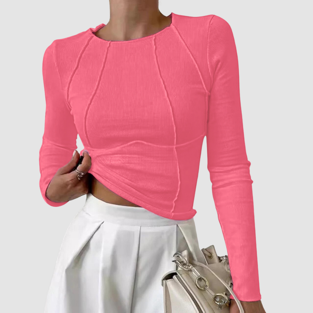 Pink ribbed knit long-sleeve top with round neck and draped asymmetrical hem