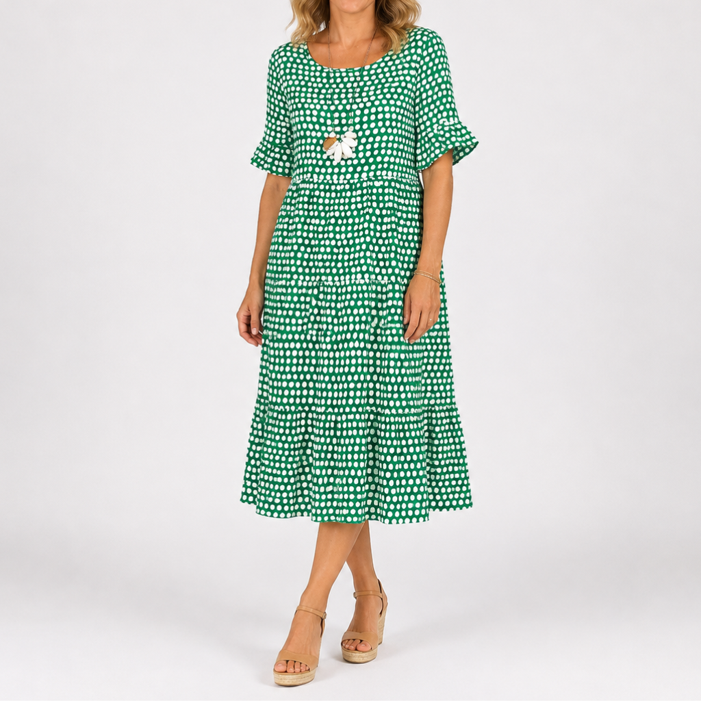 Green polka dot short-sleeve midi dress with tiered skirt and floral chest detail