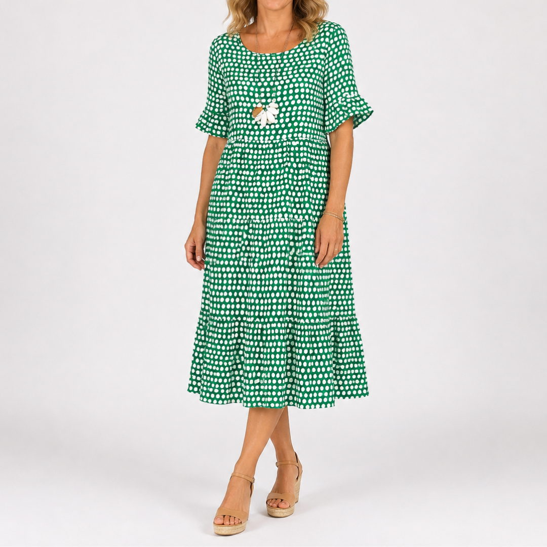 Green polka dot short-sleeve midi dress with tiered skirt and floral chest detail