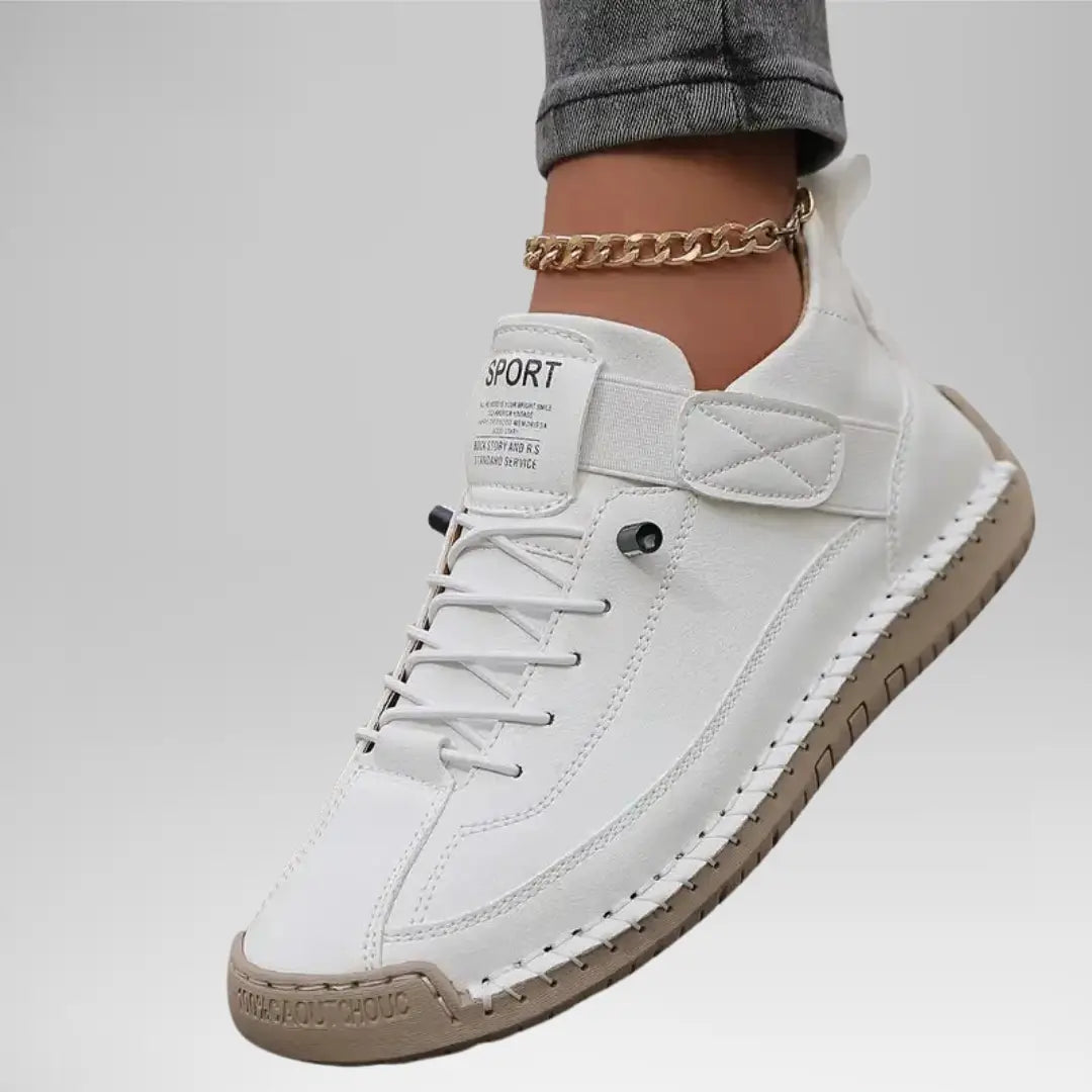 White comfort support sneaker with lace-up, ankle chain, and quilted heel strap
