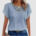 Light blue lace crochet top with scalloped yoke and open-knit sleeves