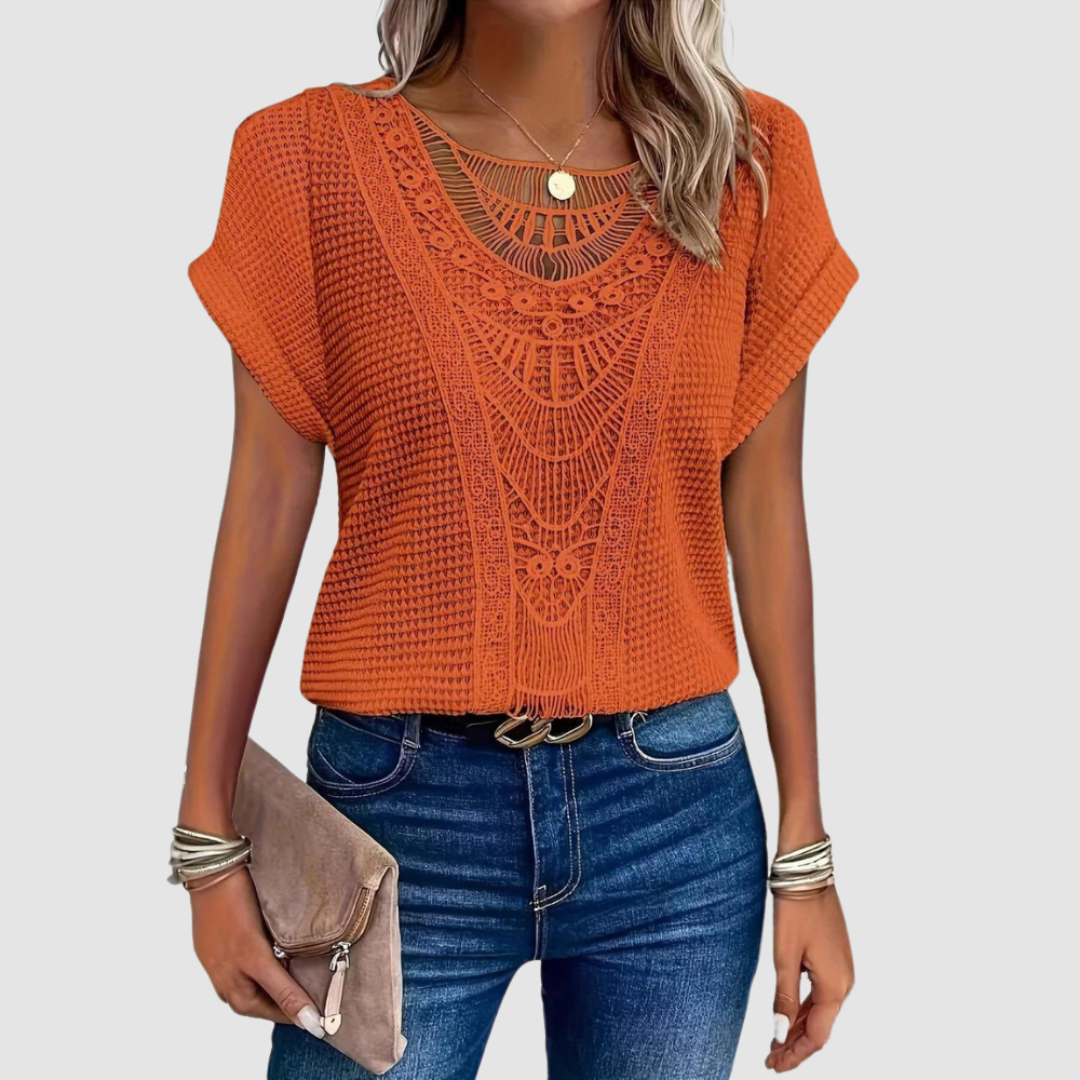 Orange lace crochet top with ornate central motif and short batwing sleeves