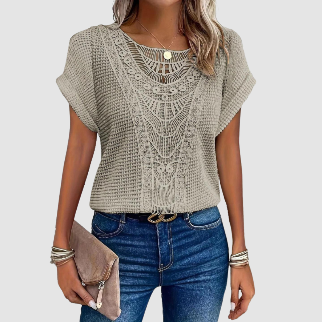 Beige lace crochet top, front view, with scalloped yoke and short batwing sleeves