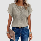 Beige lace crochet top, front view, with scalloped yoke and short batwing sleeves