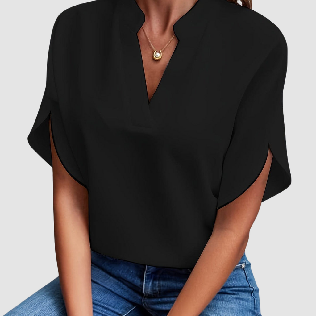 Black draped blouse with V-neck and short dolman sleeves, loose side drape