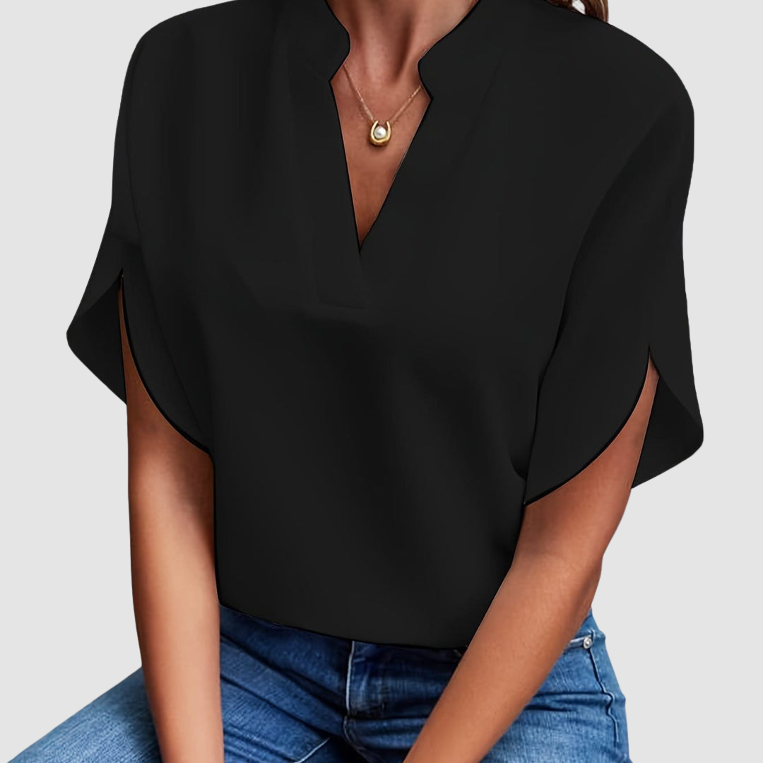 Black draped blouse with V-neck and short dolman sleeves, loose side drape
