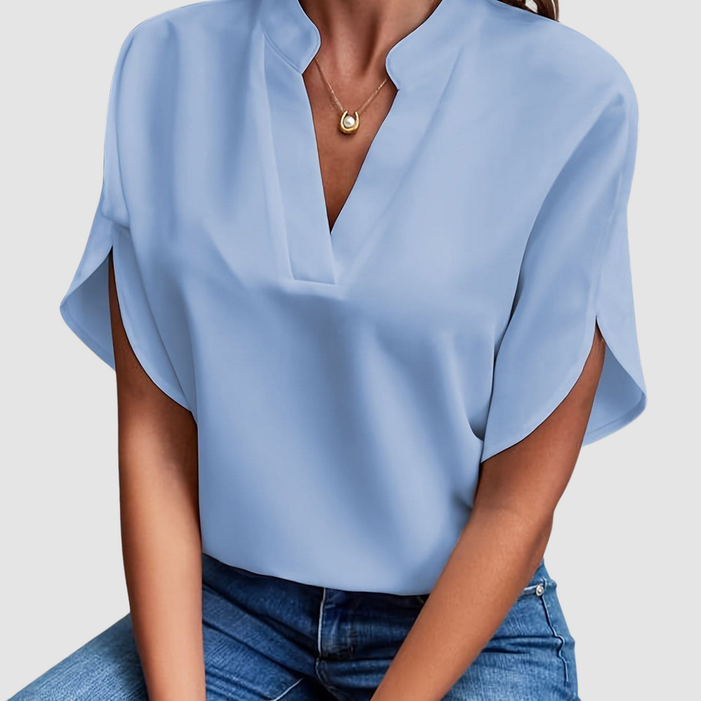 Blue draped blouse with V-neck and short dolman sleeves, loose side drape
