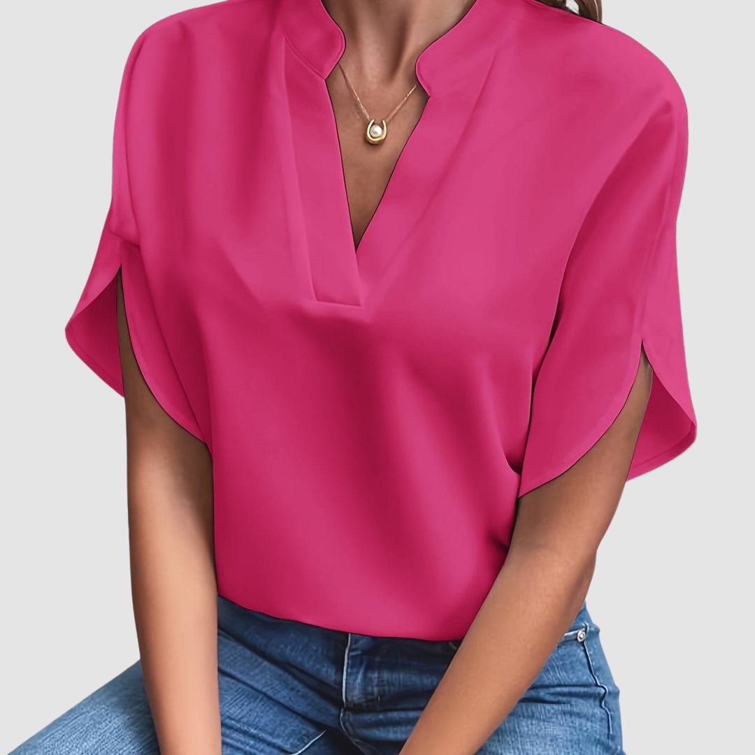 Pink draped blouse with V-neck and short dolman sleeves, loose side drape