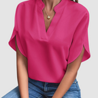 Pink draped blouse with V-neck and short dolman sleeves, loose side drape