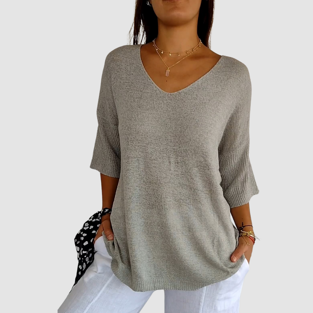 Gray knit V-neck top with short sleeves, relaxed fit