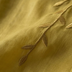 Yellow cotton-linen fabric with stitched leaf embroidery