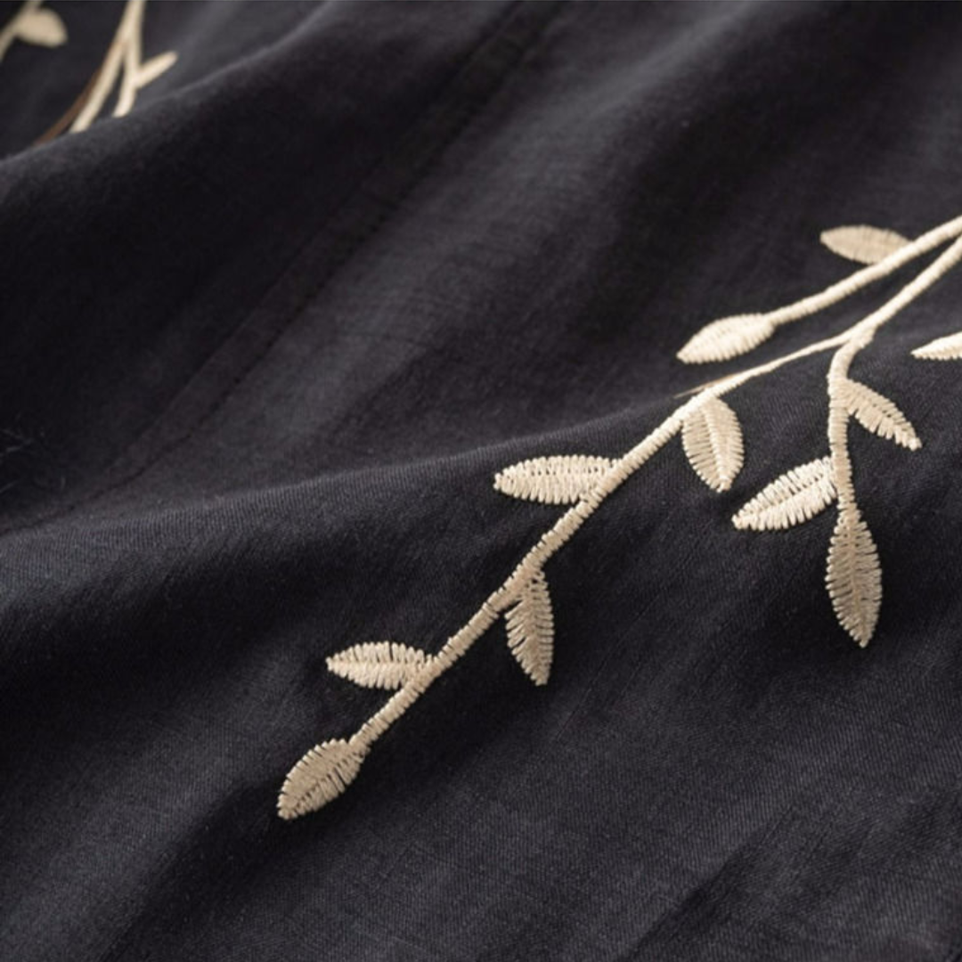 Dark navy top with cream leaf embroidery detail