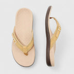 Yellow orthopedic sandals with textured footbed and adjustable ankle strap