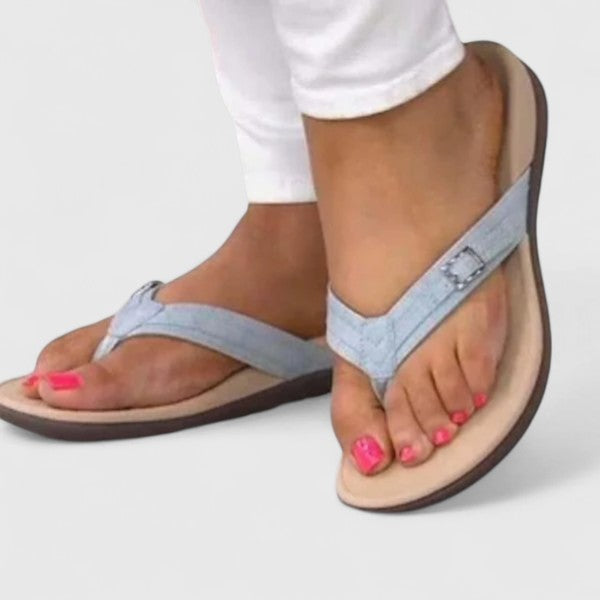 Light blue orthopedic sandals worn with adjustable ankle strap