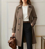 Khaki belted trench coat with buttoned cuffs and long sleeves
