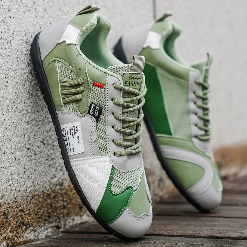Colorful retro sneakers close-up: white and sage green with matching lace-up