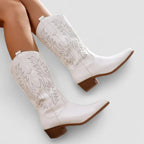 White orthopedic western boots with leaf-embroidered panels and low stacked heel