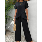 Black draped two-piece set: short-sleeve top and wide-leg pants