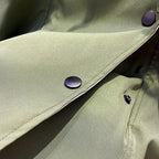 Olive windbreaker fabric with two-tone metal snaps on the front flap